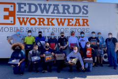 Edwards Workwear Mobile safety shoe store with teens in front