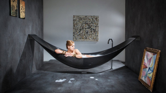 Woman in black hammock bathtub