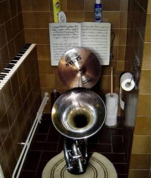 Toilet made from a large horn and cymbals